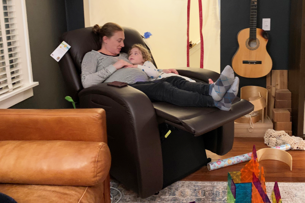 Pregnant Mother and Child In a Golden Power Lift Chair Recliner