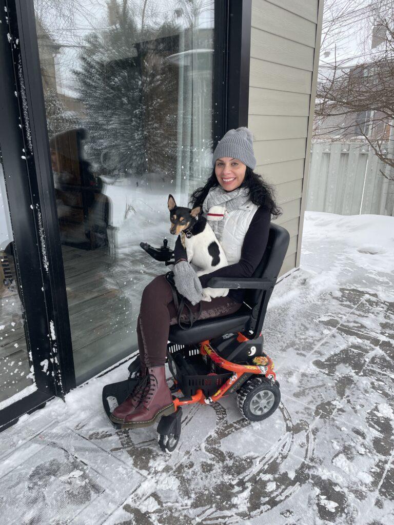 Anna Giannakouros with her dog on the Golden LiteRider Envy Power Wheelchair3